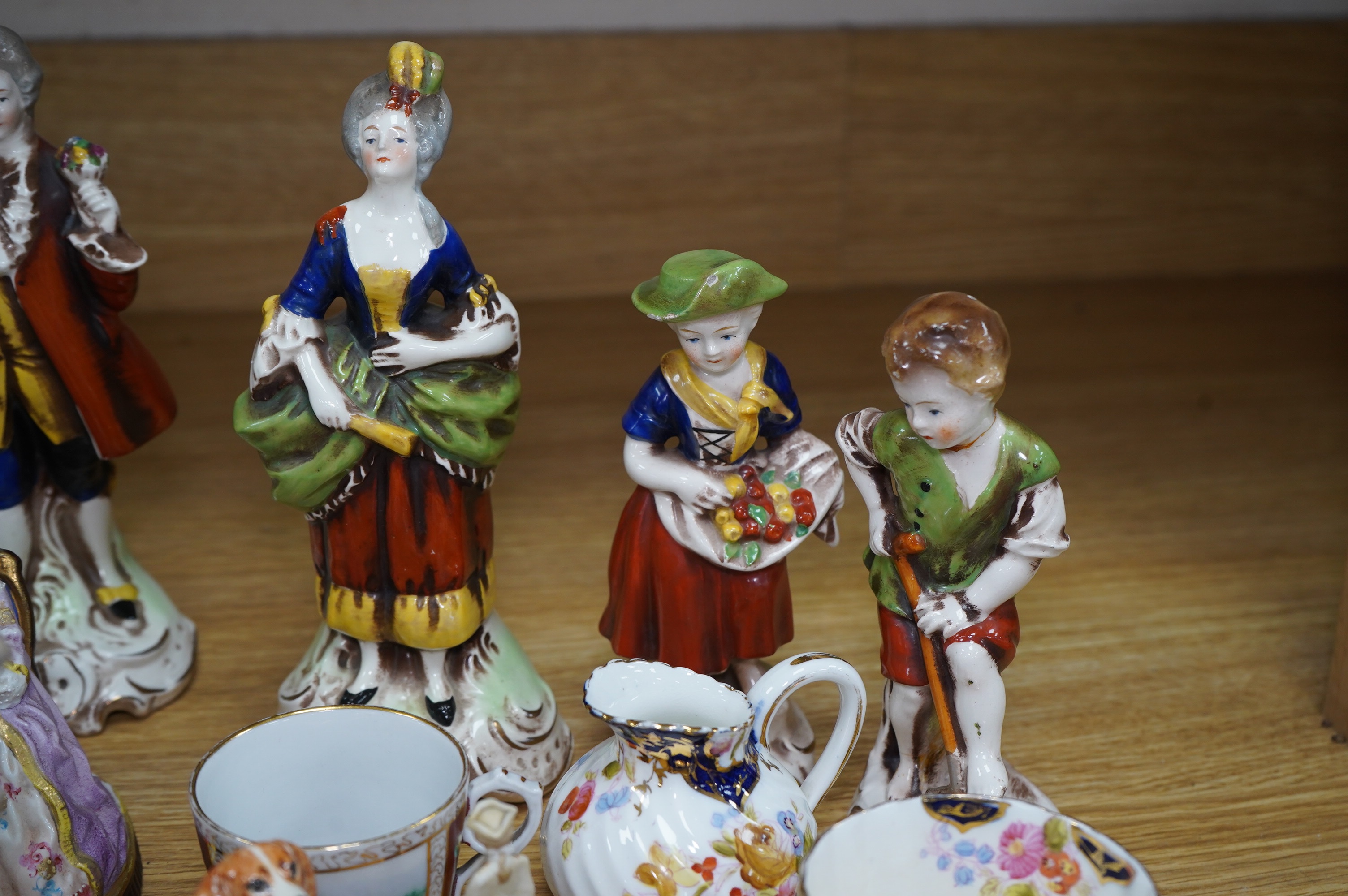 A quantity of 19th and early 20th century ceramics including two chess playing groups, four further Continental figures, a copy of a Meigh teapot, three cups and saucers, two Meissen pots and covers, etc. Condition - var